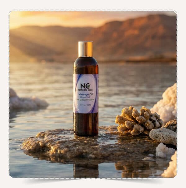 زيت مساج اللوز والعناية الثلاثية Massage Oil Almond Oil على صخرة وسط البحر في عمان وقت الغروب.