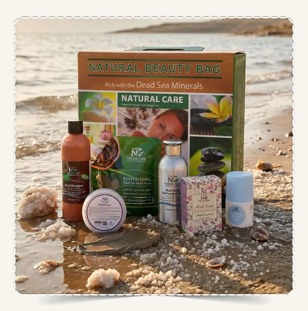 مجموعة هدايا البحر الميت Dead Sea Gift Set - Natural Care Beauty Bag على شاطئ البحر في عمان وقت الغروب.