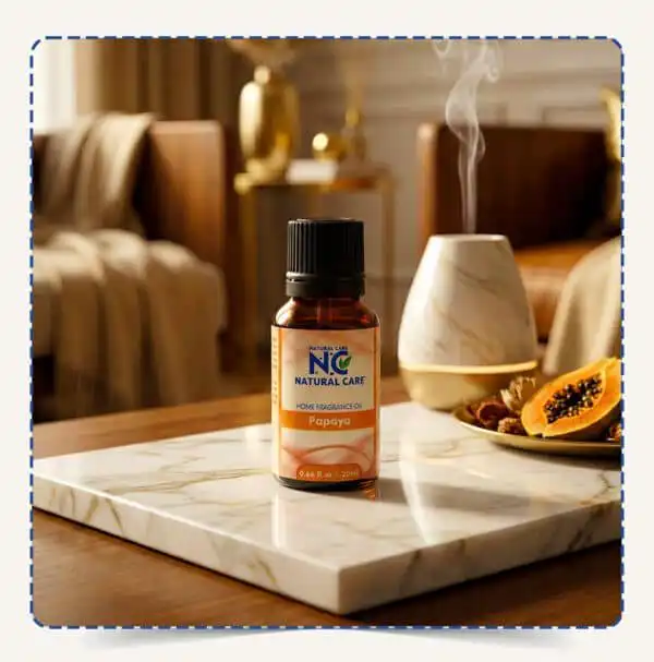 مبخرة كهربائية تنشر بخاراً معطراً بزيت Papaya Diffuser Oil من ناتشورال كير، بجوار زجاجة الزيت وثمرة بابايا طازجة في أجواء منزلية استوائية مريحة.