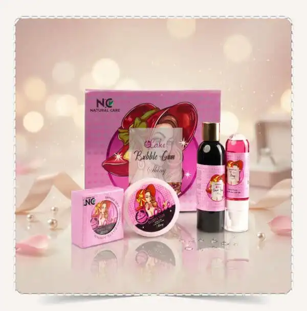 طقم شايني | NC Shiny Gift Set من Natural Care Oman ناتشرال كير عمان — عرض طقم الهدايا الوردي ومنتجات العناية بالجسم مع خلفية لامعة وبتلات ورد