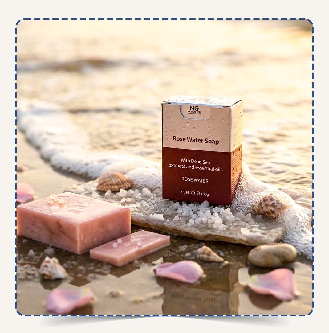 صابون ماء الورد (Rose Water Soap) من Natural Care Oman | ناتشورال كير عمان على الشاطئ مع قطعة صابون وأملاح البحر الميت