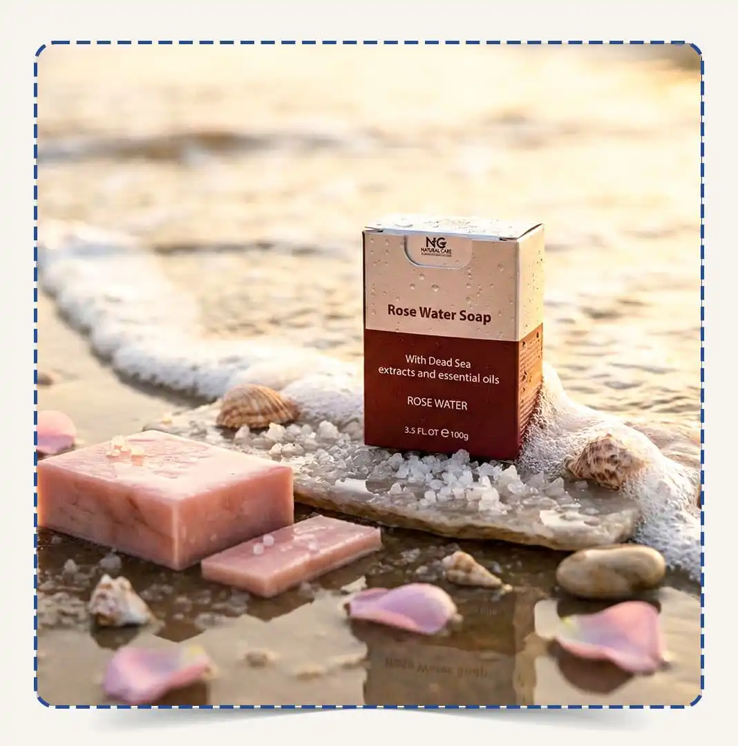 صابون ماء الورد (Rose Water Soap) من Natural Care Oman | ناتشورال كير عمان على الشاطئ مع قطعة صابون وأملاح البحر الميت